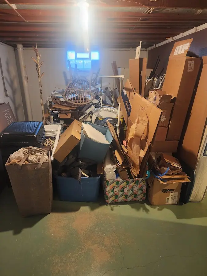 Roll-off dumpster container at job site for 4 Yard Dumpster Rental in Burtchville