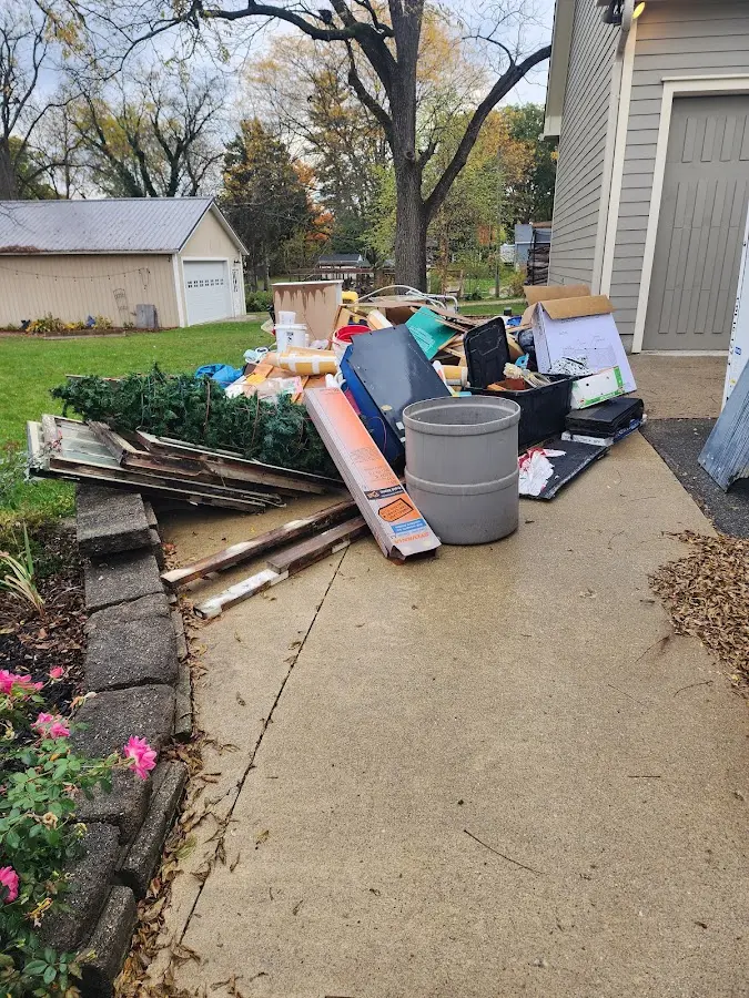 Dumpster being loaded with debris for Residential Dumpster Rental in Burtchville